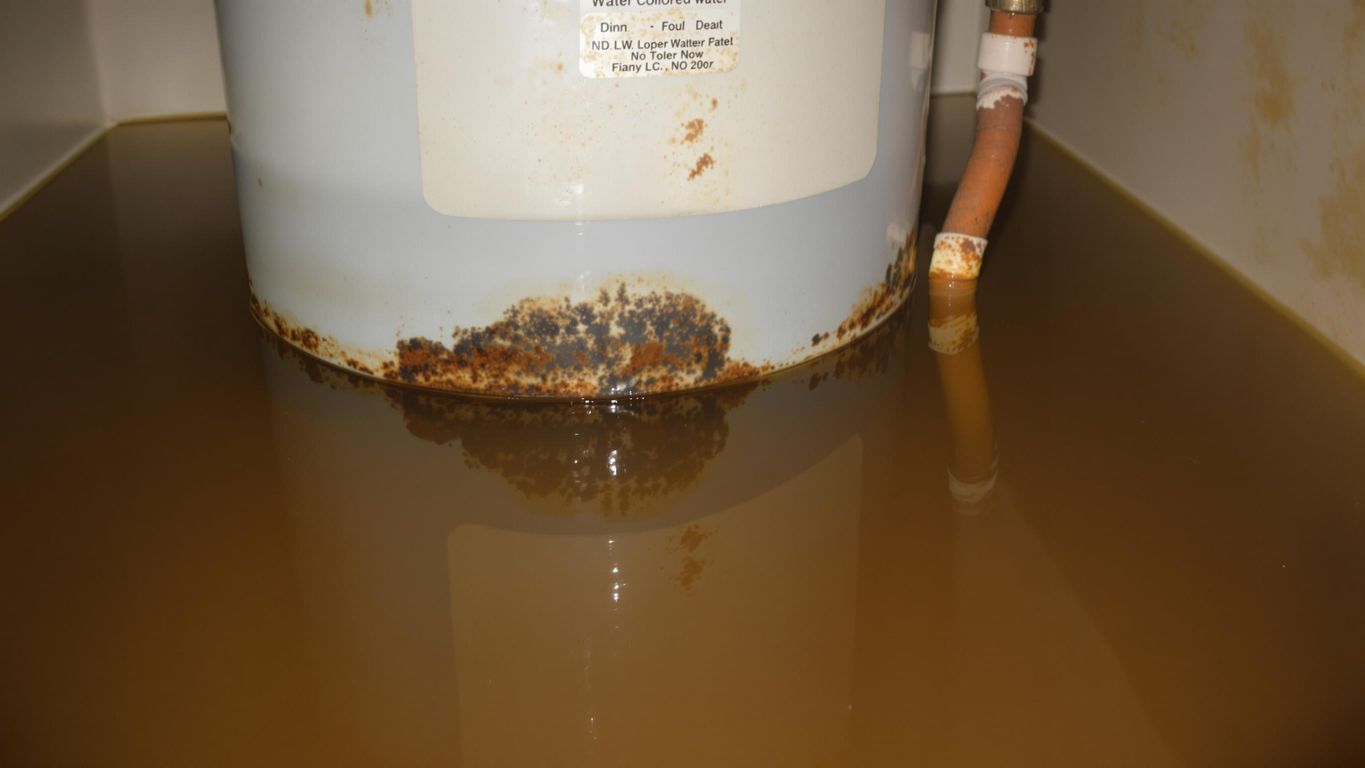 Water heater with rust and discolored water.