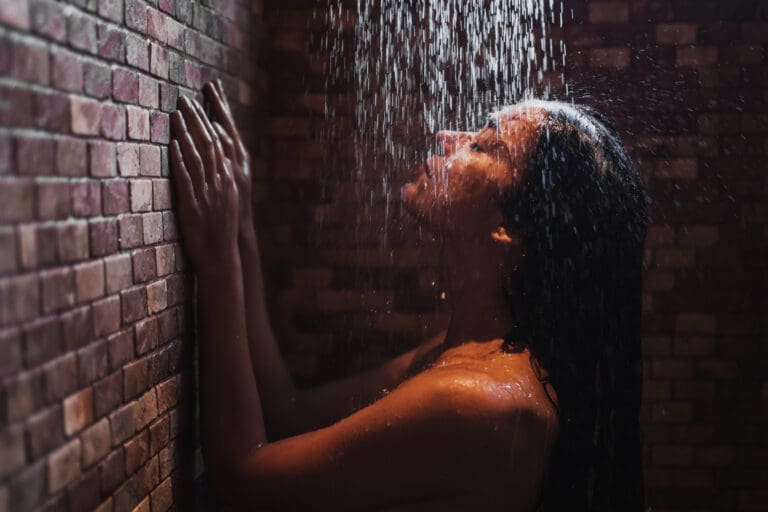 Woman in a hot shower after repairs